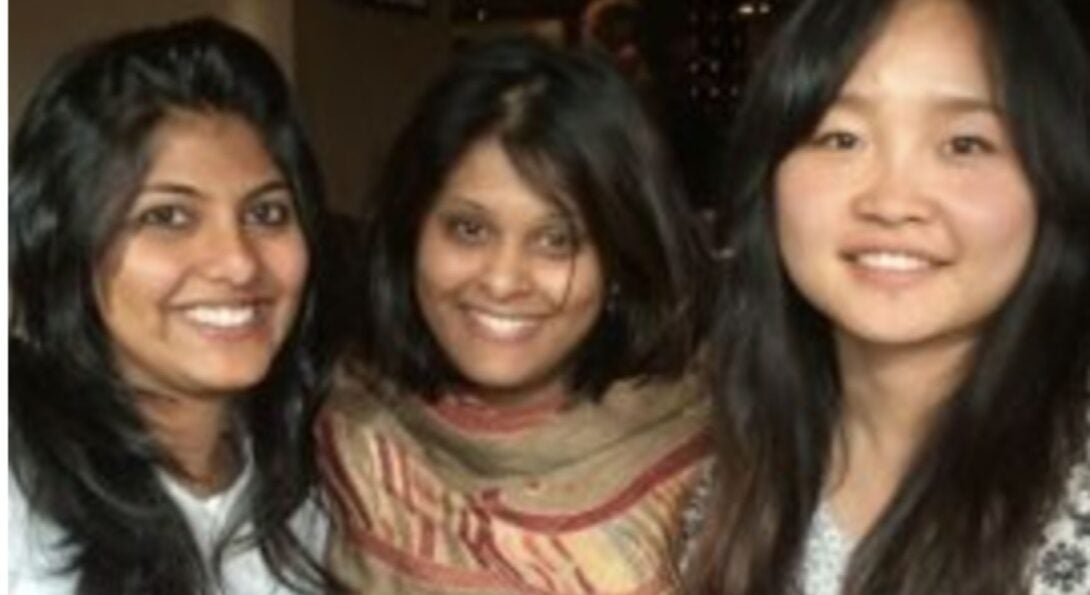 3 women smile at the camera