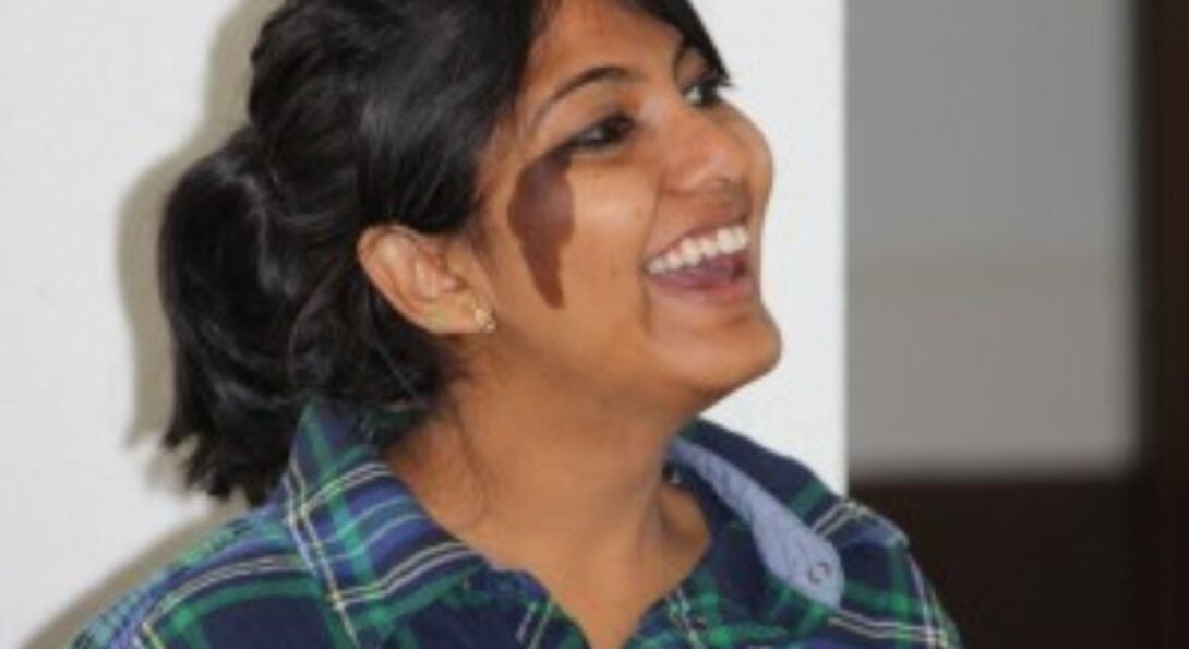 a women in profile smiling